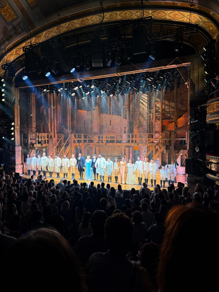 the actors taking a bow at the hamilton show on broadway